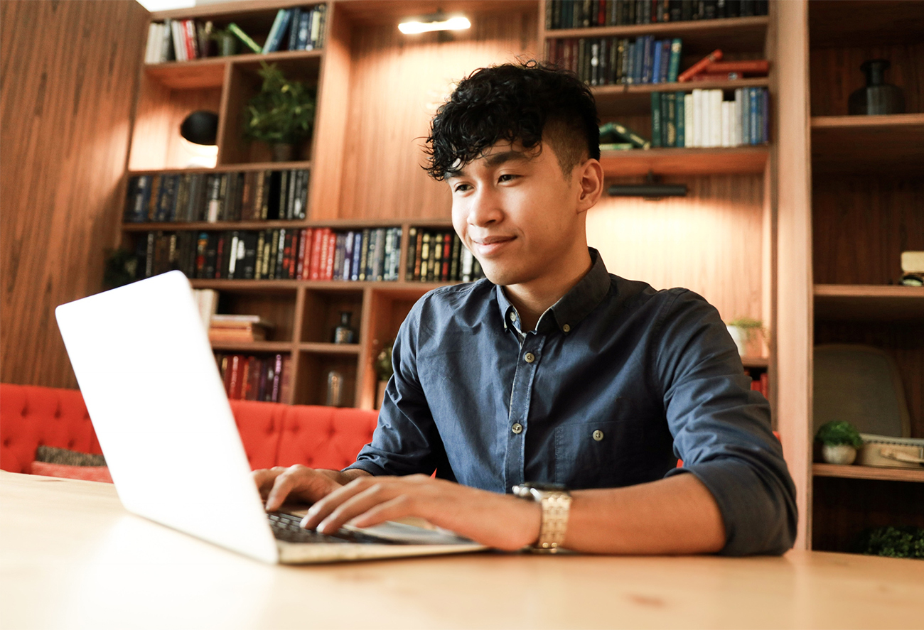 college guy on computer